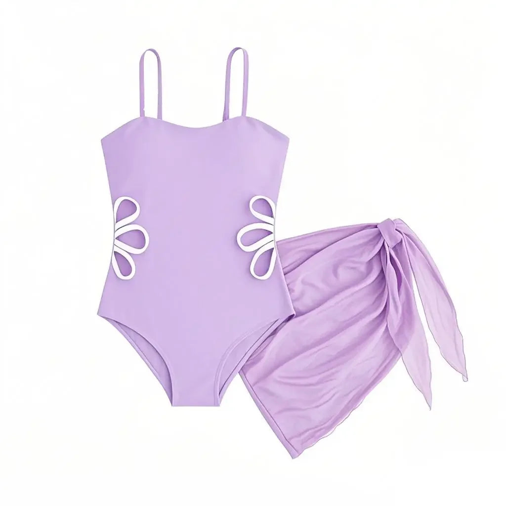 Purple swimsuit with floral designs on a white background