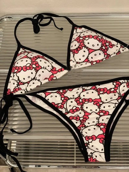 Hello Kitty-themed bikini set on a hanger against a neutral background
