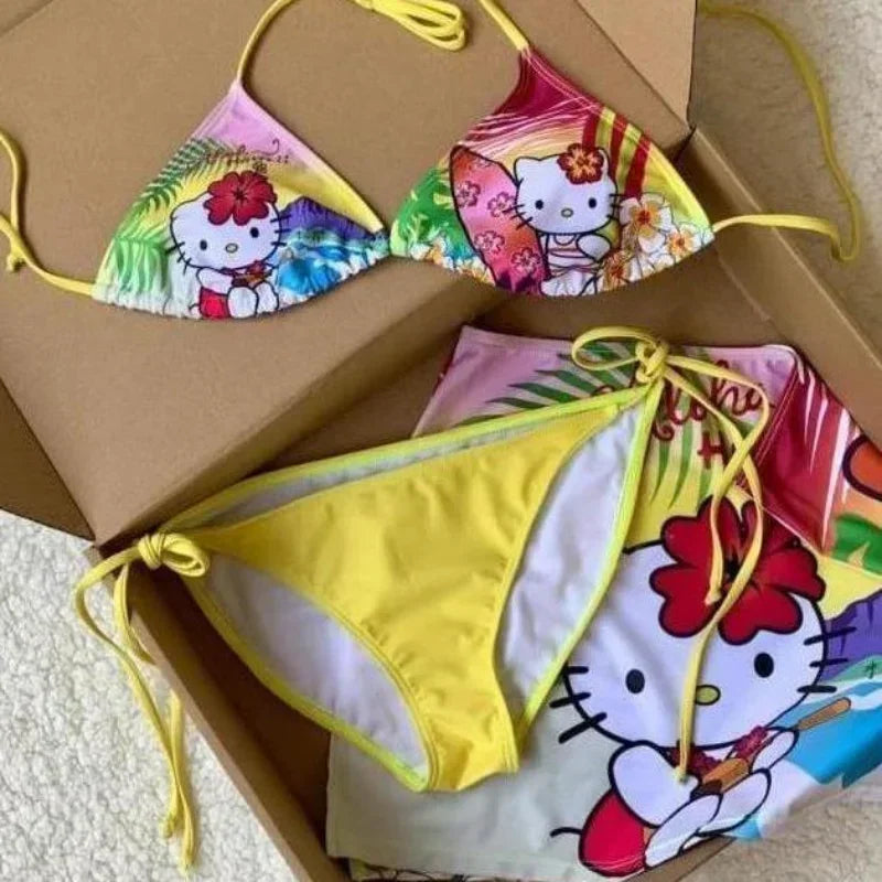 Colorful Hello Kitty bikini set with a box on a light background