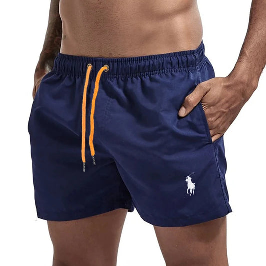 Navy Blue swim shorts with a brand logo on a white background