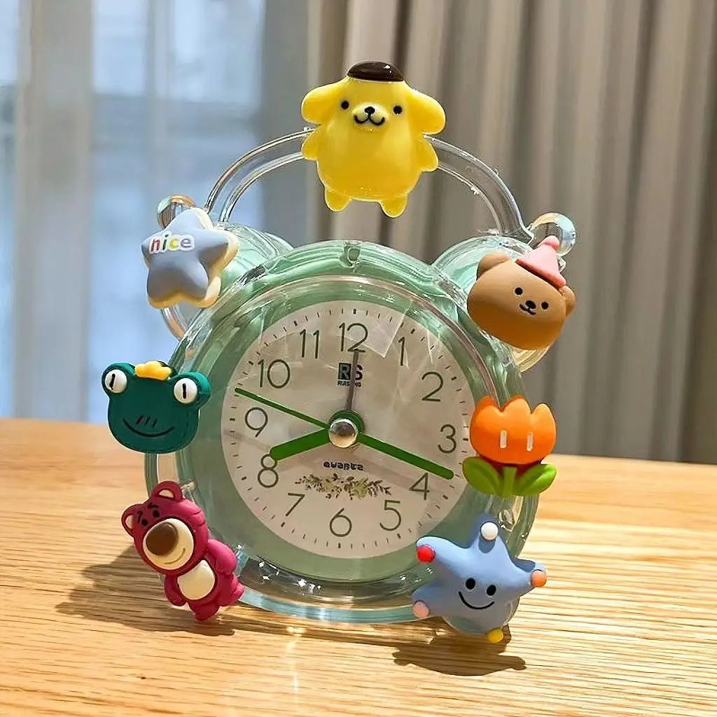 Cute alarm clock with cartoon character decorations on a wooden surface
