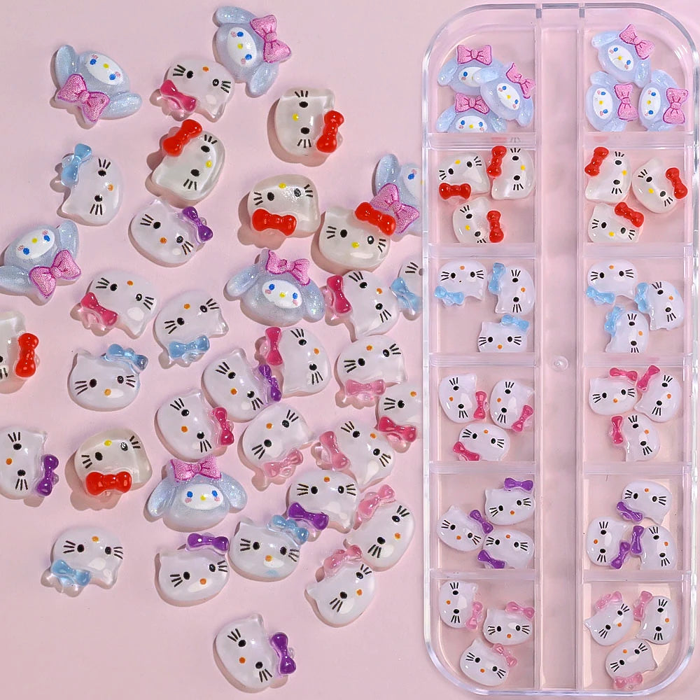Cartoon cat-shaped nail art stickers with colorful bows on a pink background
