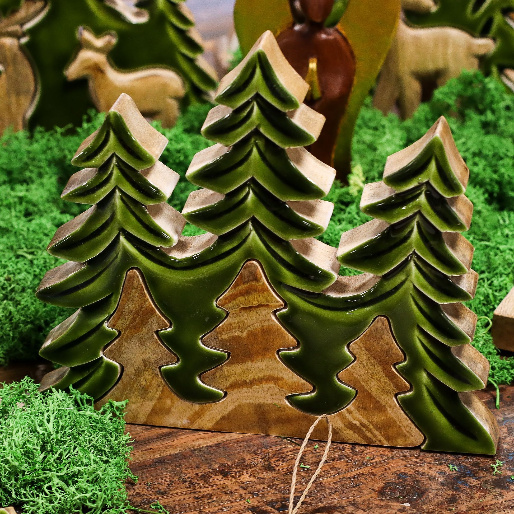 Lost In The Forest - Three Trees 3D Wooden Decoration surrounded by moss, featuring vivid green enamel trees, perfect for bringing nature indoors as a {{scent}} {{product_type}} – Christmas Gift Home Fragrance.