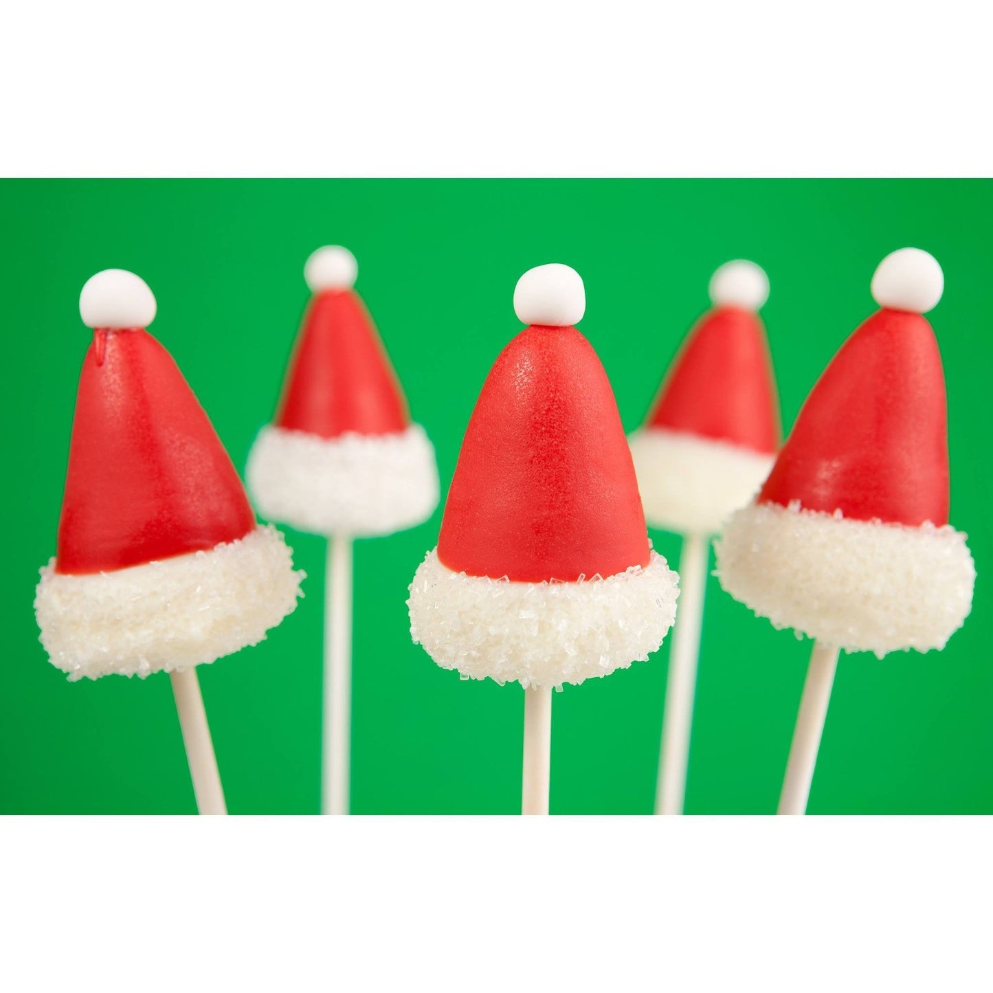 Handmade Christmas Santa hat cake pops with red chocolate coating and white trim